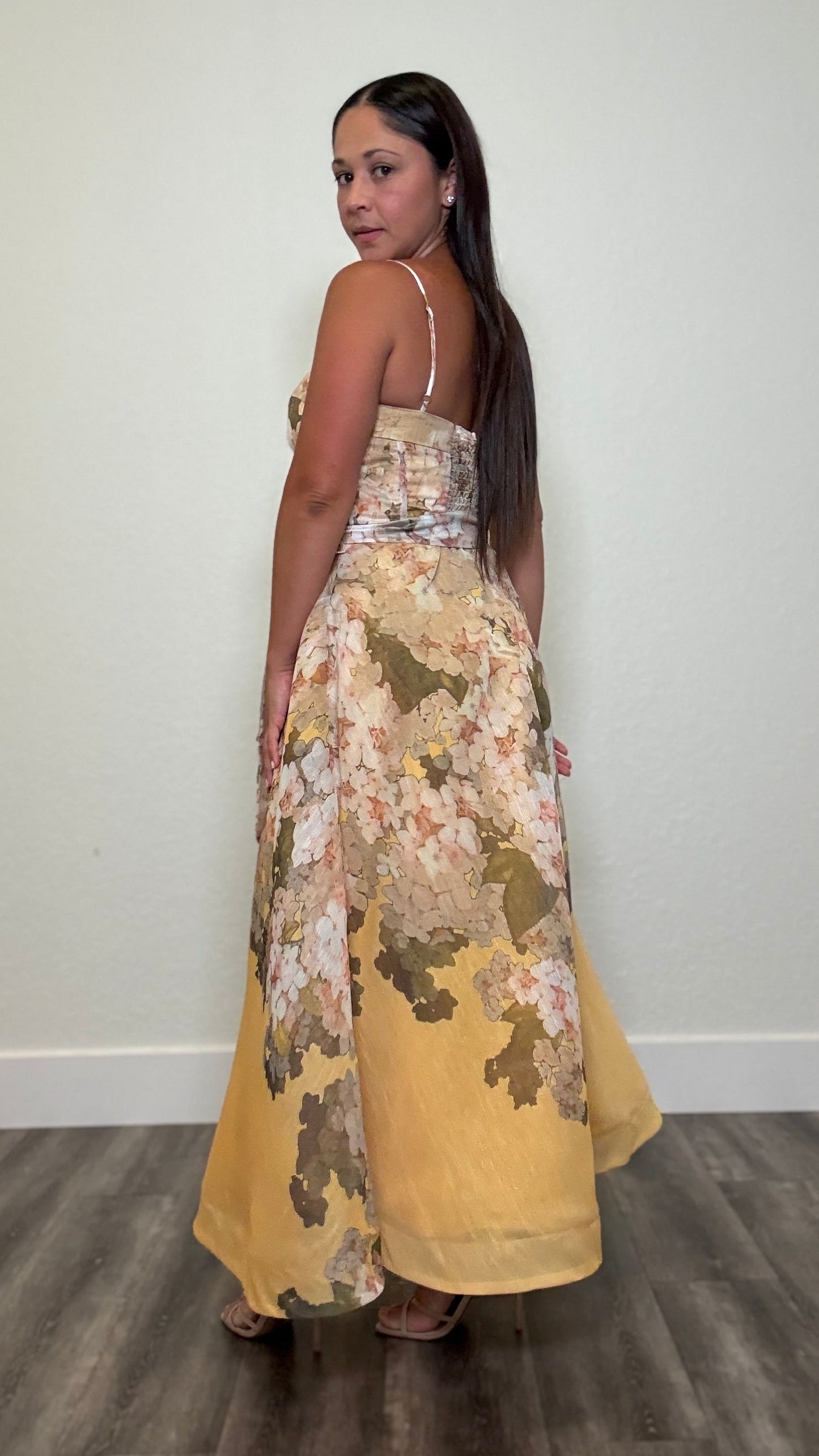 woman wearing a maxi yellow floral dress