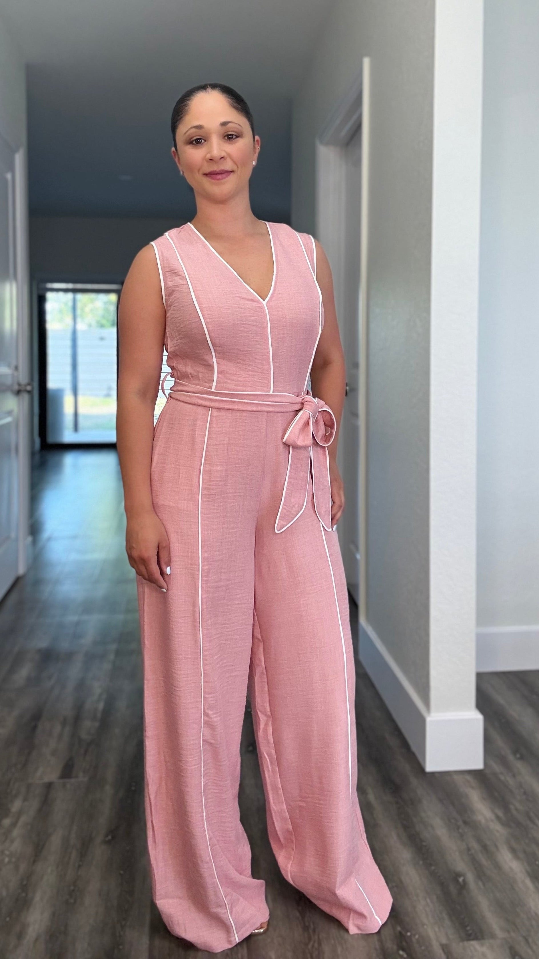 Pink jumpsuit with waist tie