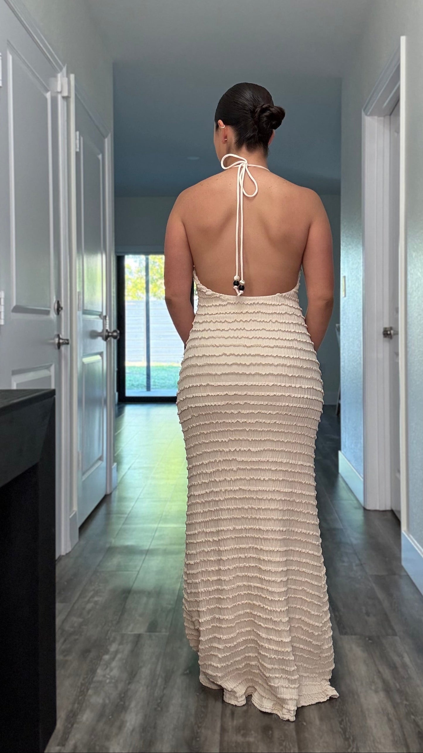 back side of beige maxi dress with open back 